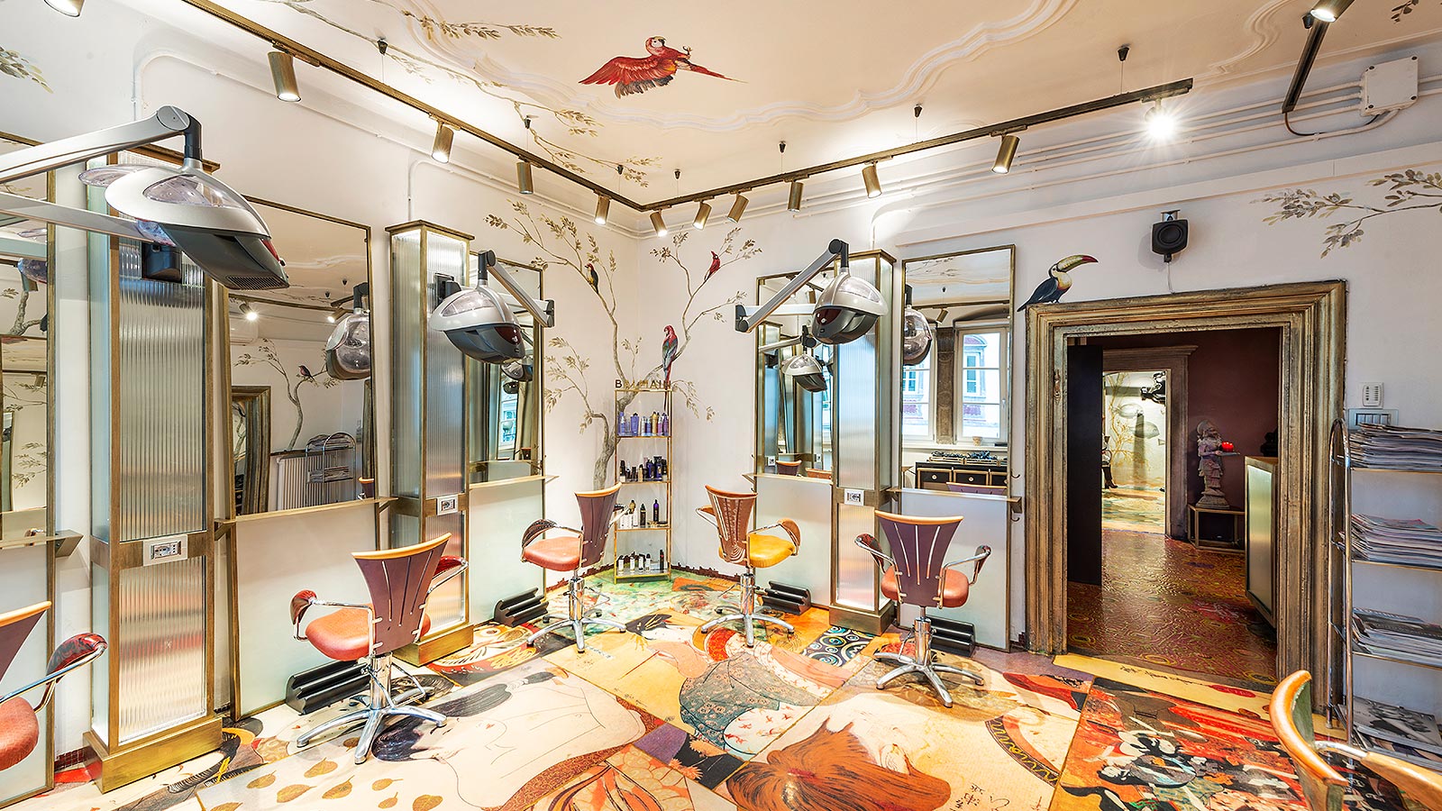 Detail on the armchairs of the historic hairdresser's salon in Bolzano, with colourful walls and floors